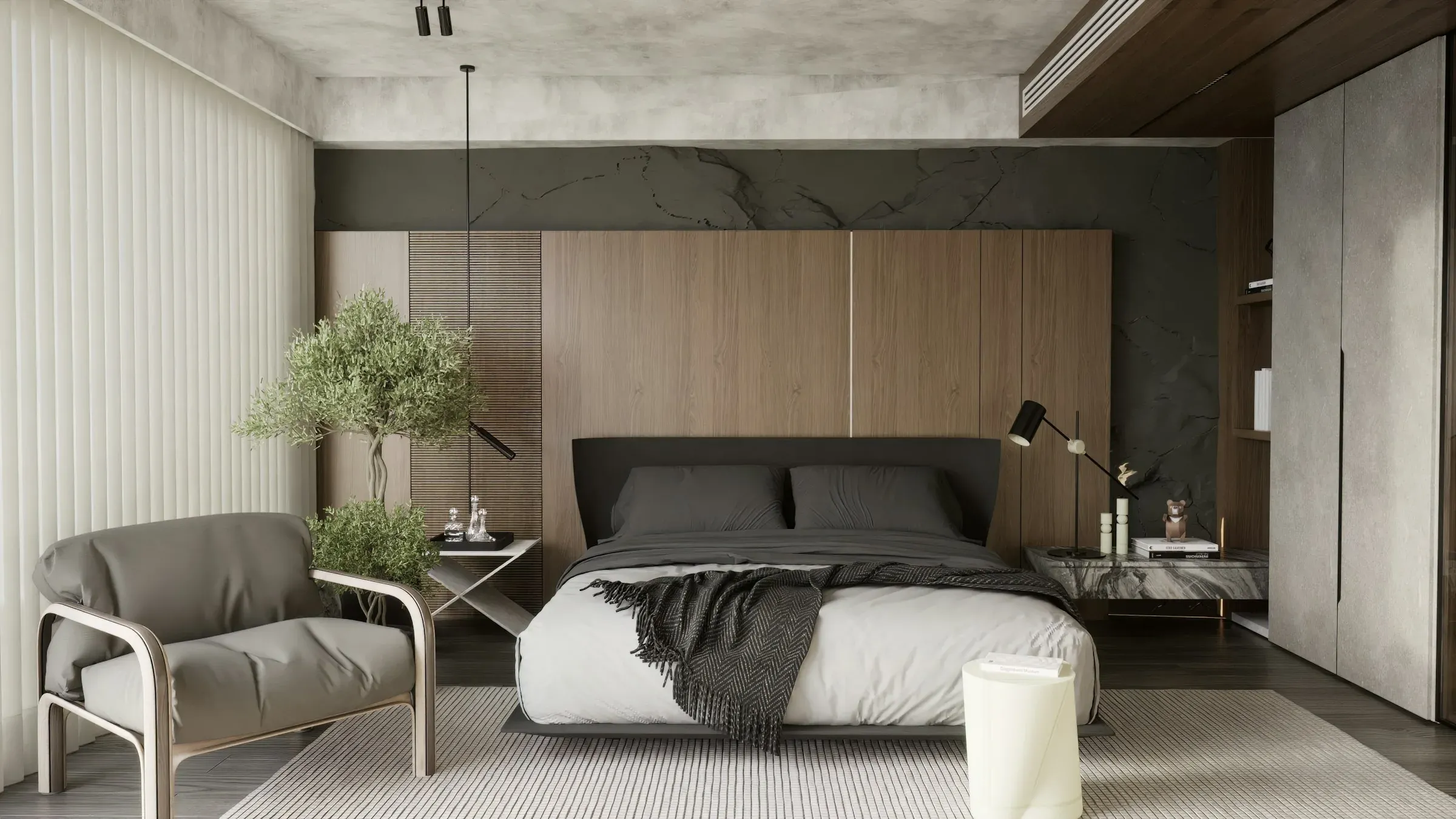 A bedroom with a wood-panelled wall, a low bed, an armchair and vertical blinds